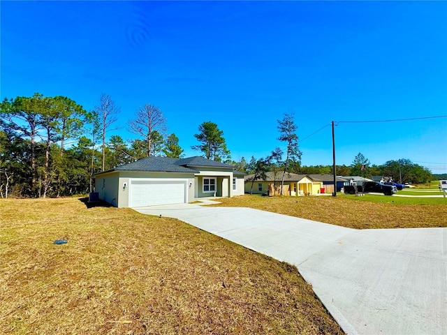 single story home with a garage, stucco siding, concrete driveway, and a front yard