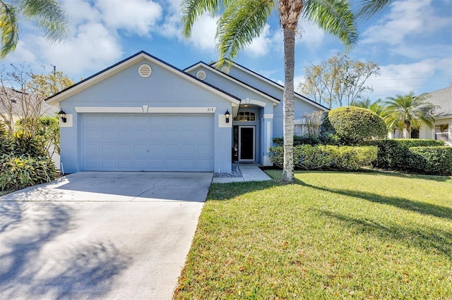 ranch-style home with a garage, driveway, a front yard, and stucco siding