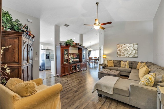 living room with high vaulted ceiling, dark wood-style flooring, visible vents, and ceiling fan