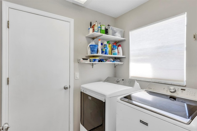 laundry area with laundry area and separate washer and dryer