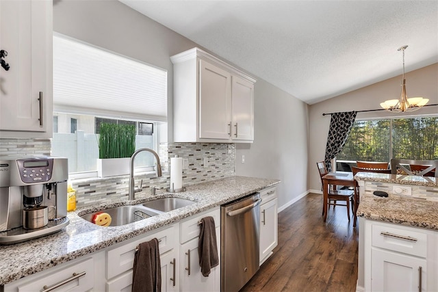 kitchen featuring a notable chandelier, dark wood-type flooring, vaulted ceiling, a sink, and dishwasher