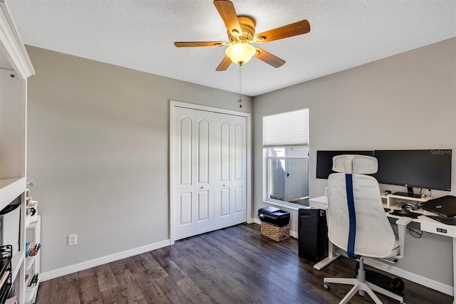 office with dark wood finished floors, a textured ceiling, baseboards, and ceiling fan