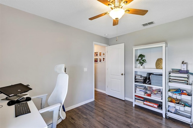 office space with ceiling fan, a textured ceiling, wood finished floors, visible vents, and baseboards