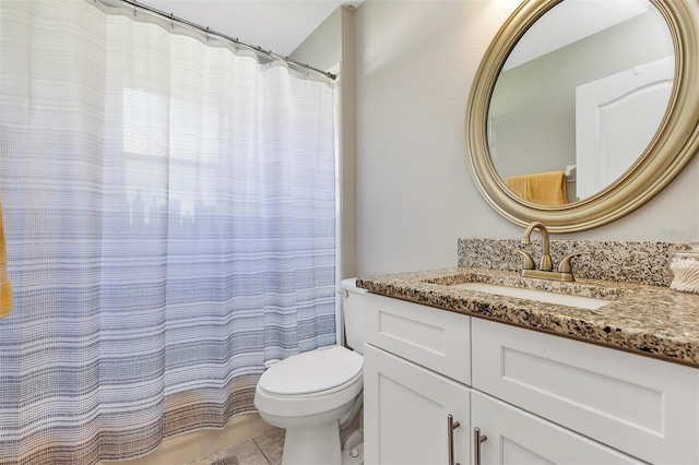 full bath featuring a shower with curtain, vanity, toilet, and tile patterned floors