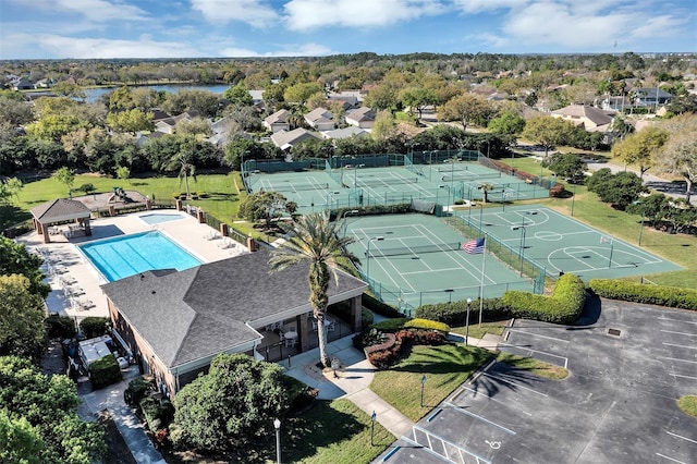 birds eye view of property with a water view