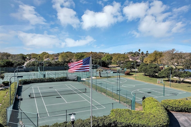 view of tennis court with fence