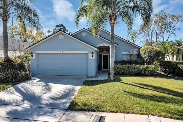 view of front of home with a garage, driveway, a front lawn, and stucco siding