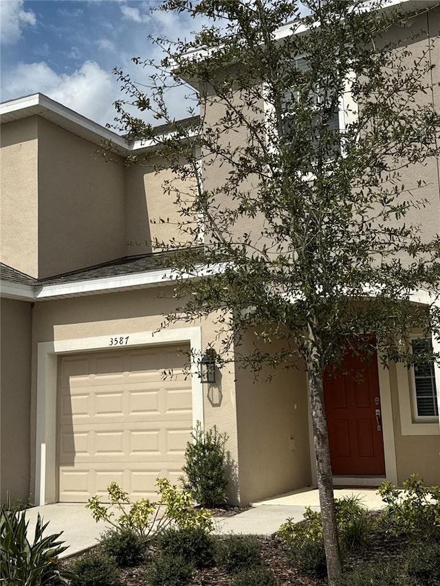 view of side of home with stucco siding