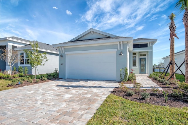 view of front of property with a garage