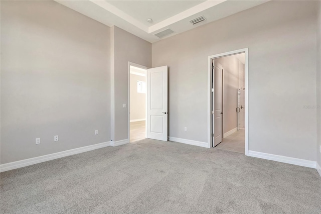 unfurnished bedroom featuring light carpet