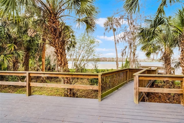 wooden terrace with a water view