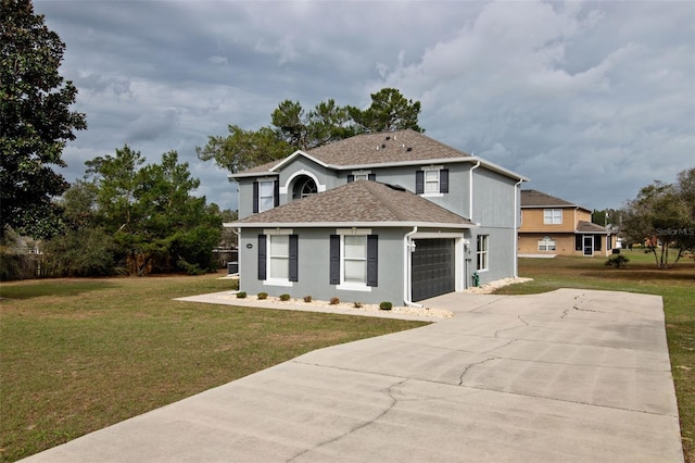 view of front property with a garage and a front yard