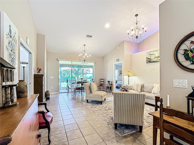 living room with high vaulted ceiling, light tile patterned floors, and a notable chandelier