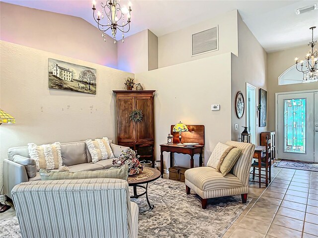 tiled living room featuring high vaulted ceiling and a chandelier