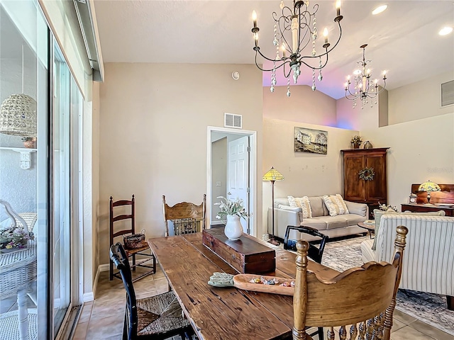 dining area featuring a notable chandelier, light tile patterned flooring, and lofted ceiling