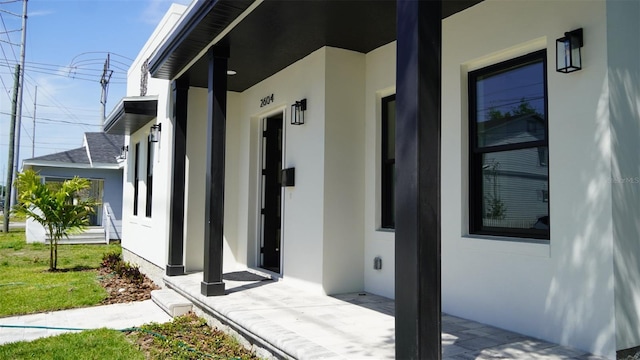 2604 E 11th Ave, Tampa, FL 33605 - view of exterior entry featuring stucco siding