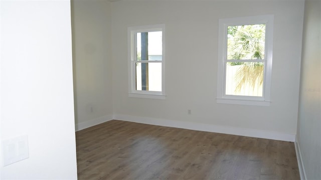 2604 E 11th Ave, Tampa, FL 33605 - spare room with baseboards and wood finished floors