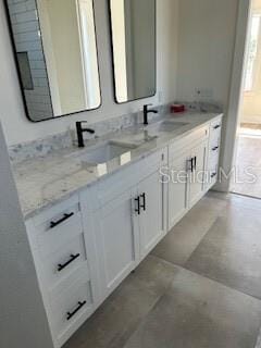 2604 E 11th Ave, Tampa, FL 33605 - bathroom featuring double vanity and a sink