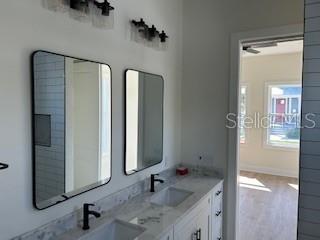 2604 E 11th Ave, Tampa, FL 33605 - bathroom with double vanity and a sink
