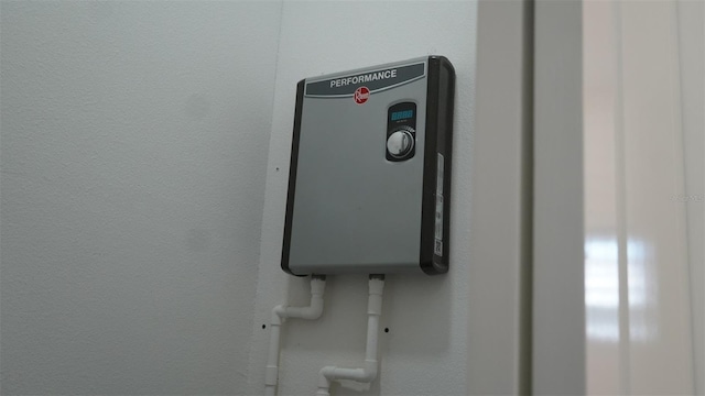 2604 E 11th Ave, Tampa, FL 33605 - interior details with water heater and a textured wall