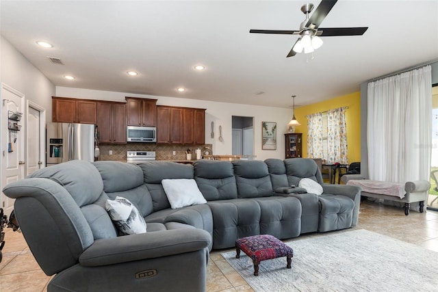 living room featuring ceiling fan, light tile patterned flooring, visible vents, and recessed lighting