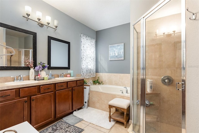 full bath with a garden tub, a sink, and a stall shower