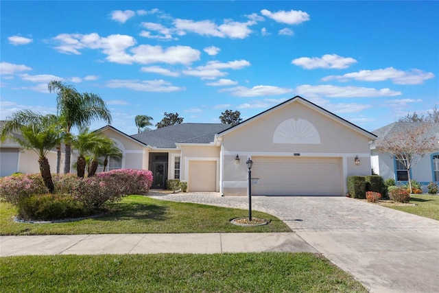 single story home featuring a front yard and a garage