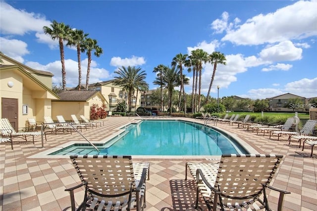 community pool featuring a patio area