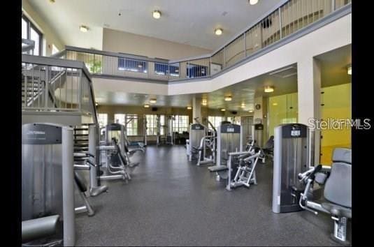 workout area featuring a high ceiling