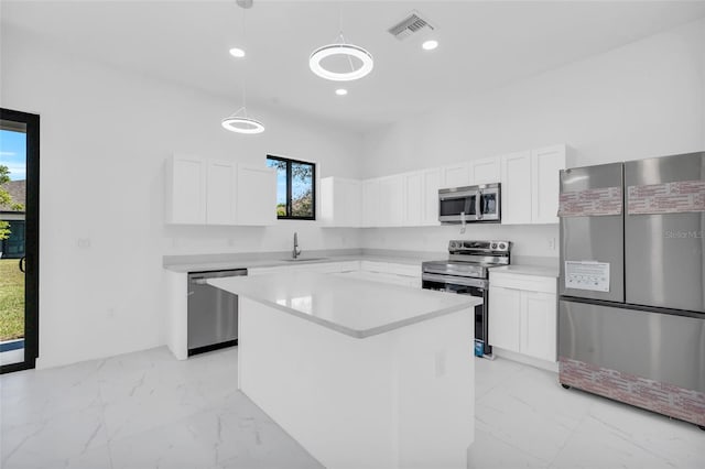 3924 NW 38th St, Cape Coral, FL 33993 - kitchen featuring appliances with stainless steel finishes, light marble finish floors, healthy amount of natural light, and recessed lighting