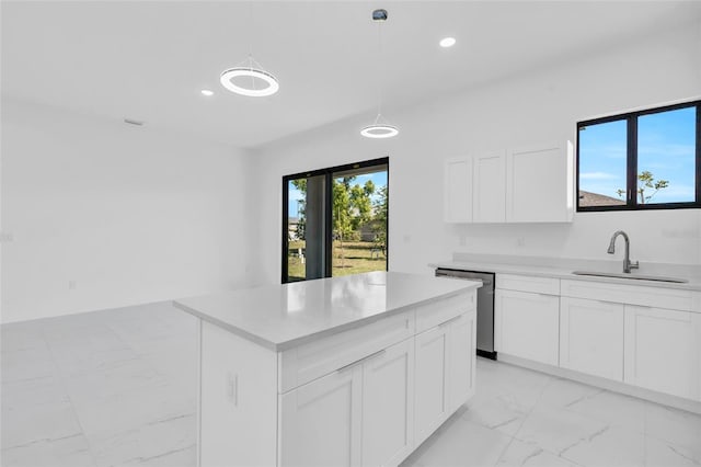 3924 NW 38th St, Cape Coral, FL 33993 - kitchen with dishwasher, light marble finish flooring, light countertops, white cabinetry, and recessed lighting