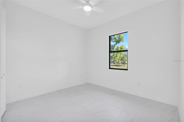 3924 NW 38th St, Cape Coral, FL 33993 - empty room featuring marble finish floors and a ceiling fan
