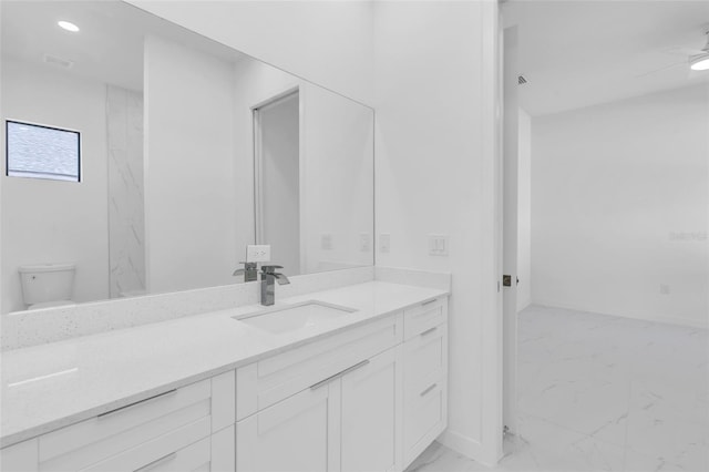 3924 NW 38th St, Cape Coral, FL 33993 - bathroom featuring marble look tile flooring, vanity, and recessed lighting