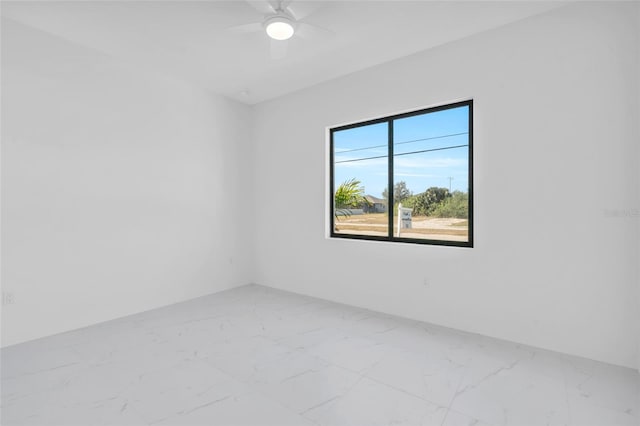 3924 NW 38th St, Cape Coral, FL 33993 - unfurnished room with marble look tile flooring and ceiling fan