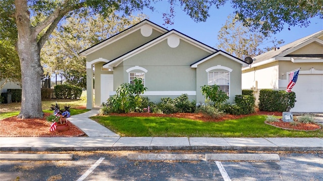 single story home with a front yard