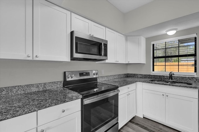 kitchen featuring sink, white cabinets, and stainless steel appliances