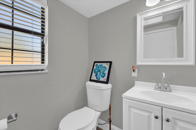 bathroom with toilet and vanity