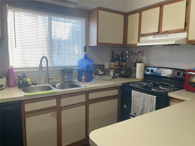 kitchen featuring black appliances, light countertops, under cabinet range hood, and a sink