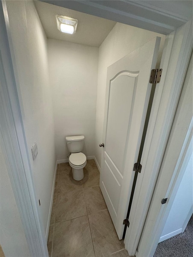 bathroom featuring tile patterned floors and toilet