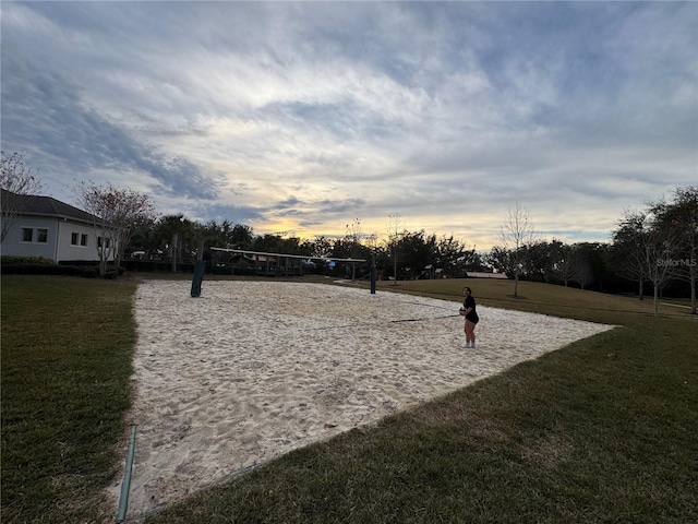 view of home's community with a yard and volleyball court