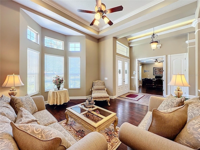 living room with dark hardwood / wood-style flooring, ornamental molding, french doors, and ceiling fan