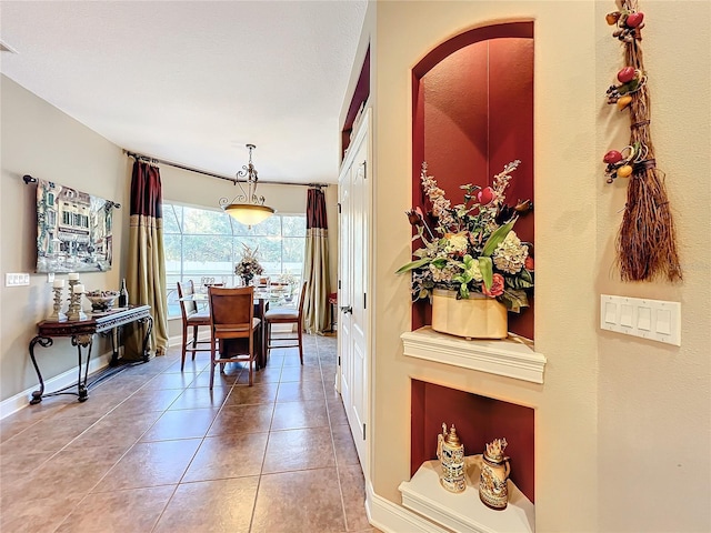 dining area featuring tile patterned flooring