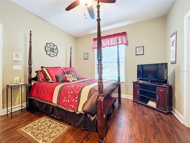 bedroom with ceiling fan and dark hardwood / wood-style floors