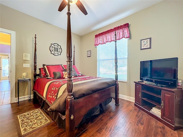 bedroom with ceiling fan and dark hardwood / wood-style flooring