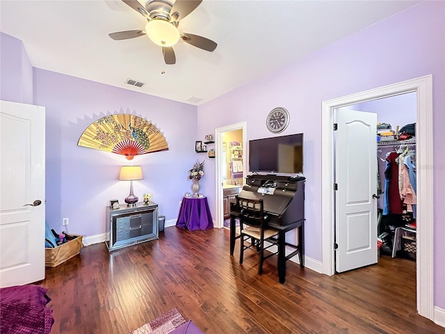 office space featuring ceiling fan and dark wood-type flooring