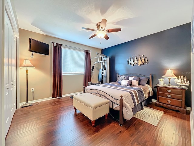 bedroom featuring hardwood / wood-style floors and ceiling fan