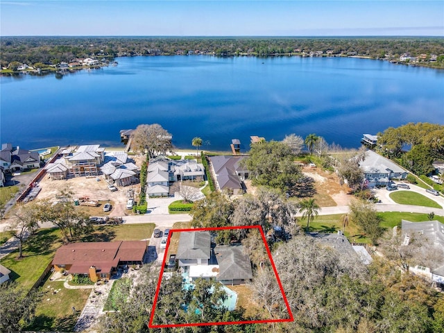 birds eye view of property featuring a residential view and a water view