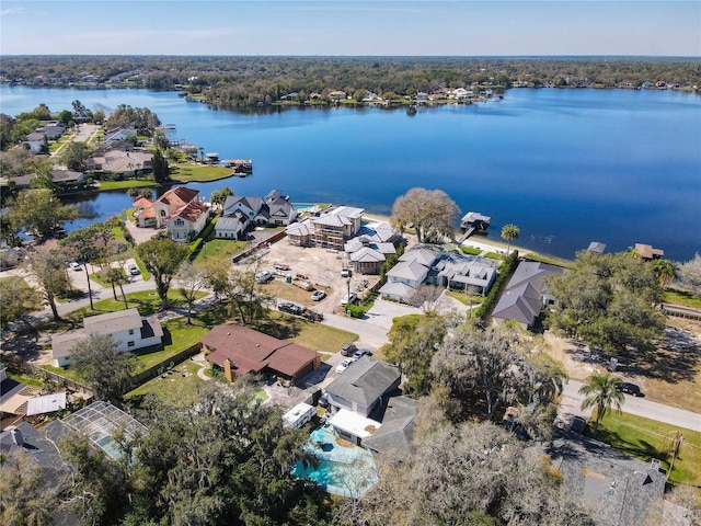 drone / aerial view with a water view and a residential view