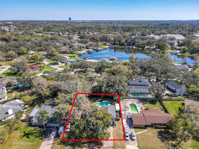 birds eye view of property featuring a residential view and a water view