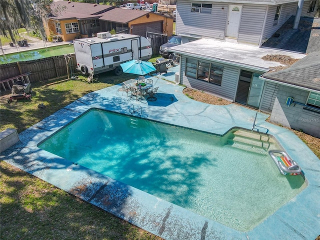 view of swimming pool with a patio area and a fenced backyard